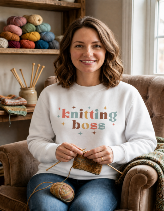 woman in white knitting boss sweatshirt