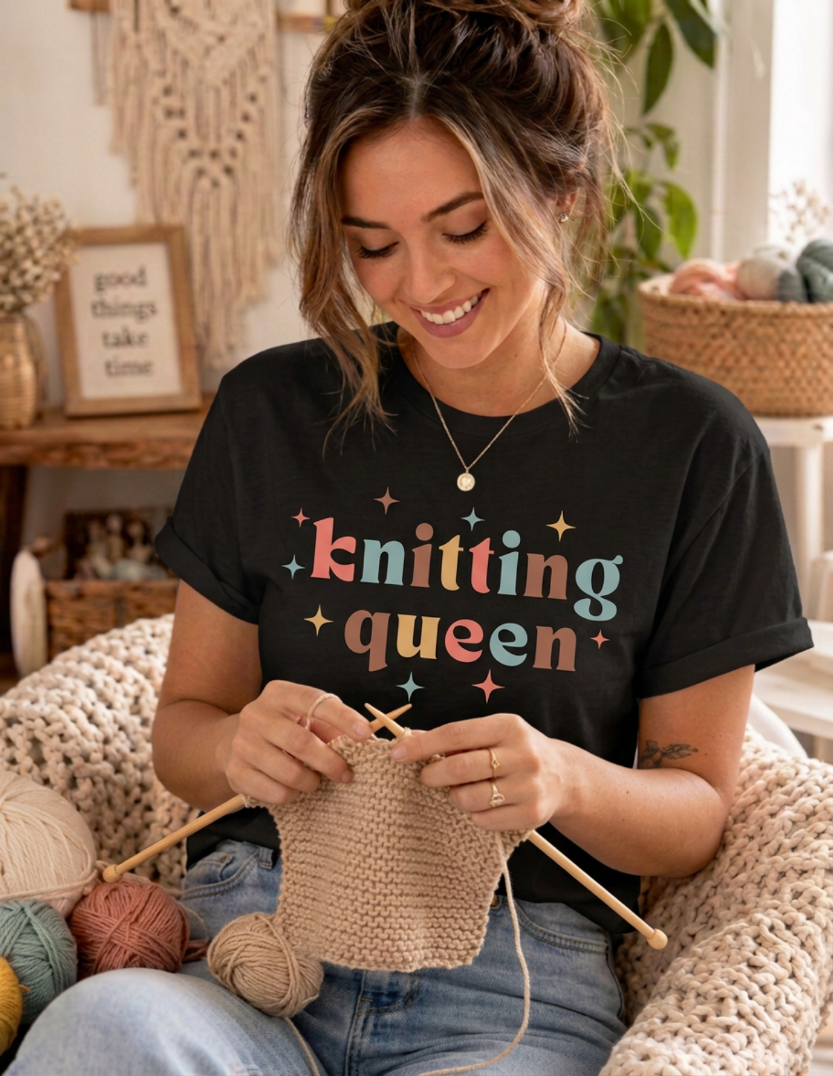 woman knitting wearing black knitting queen tshirt