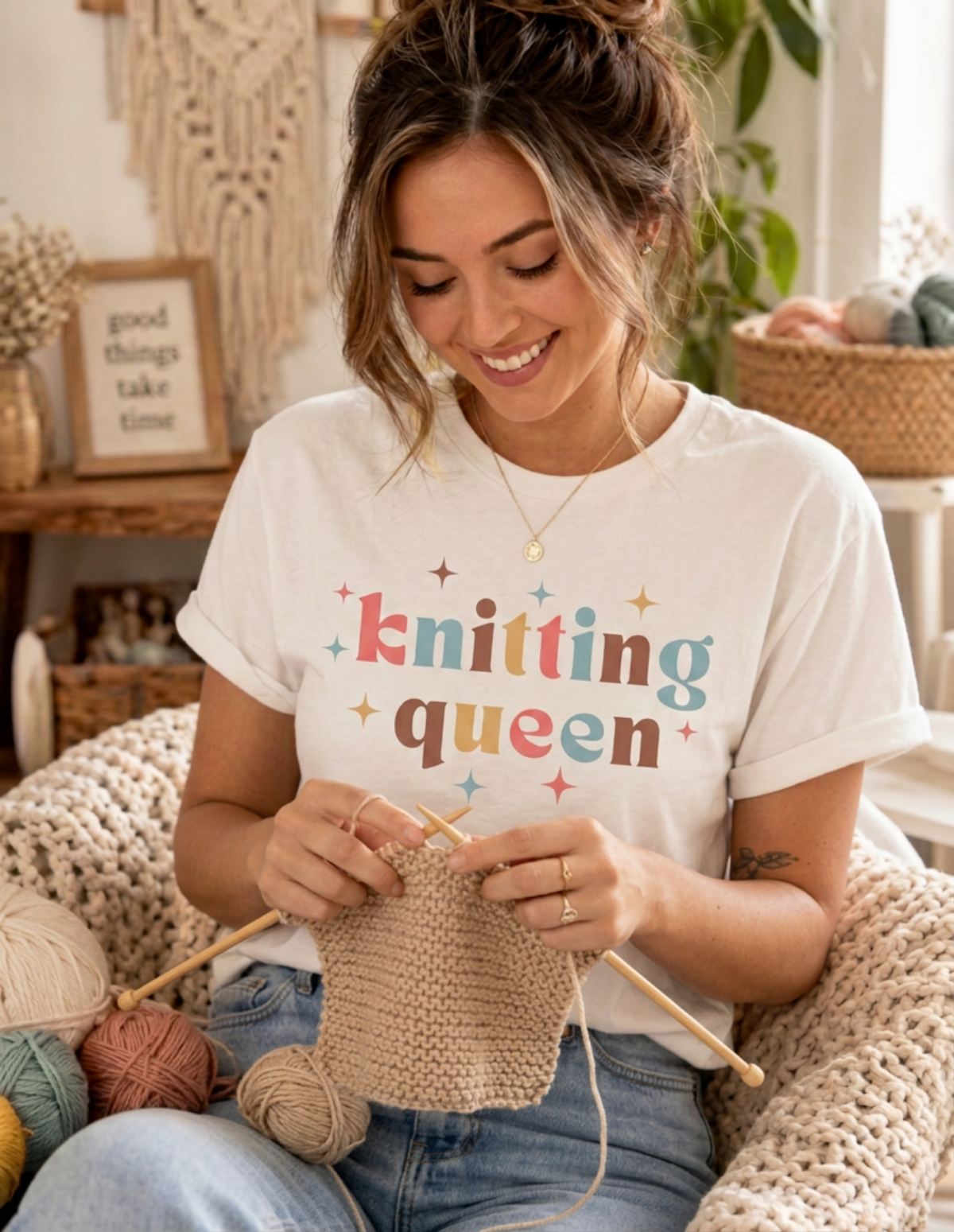 woman knitting wearing white knitting queen tshirt